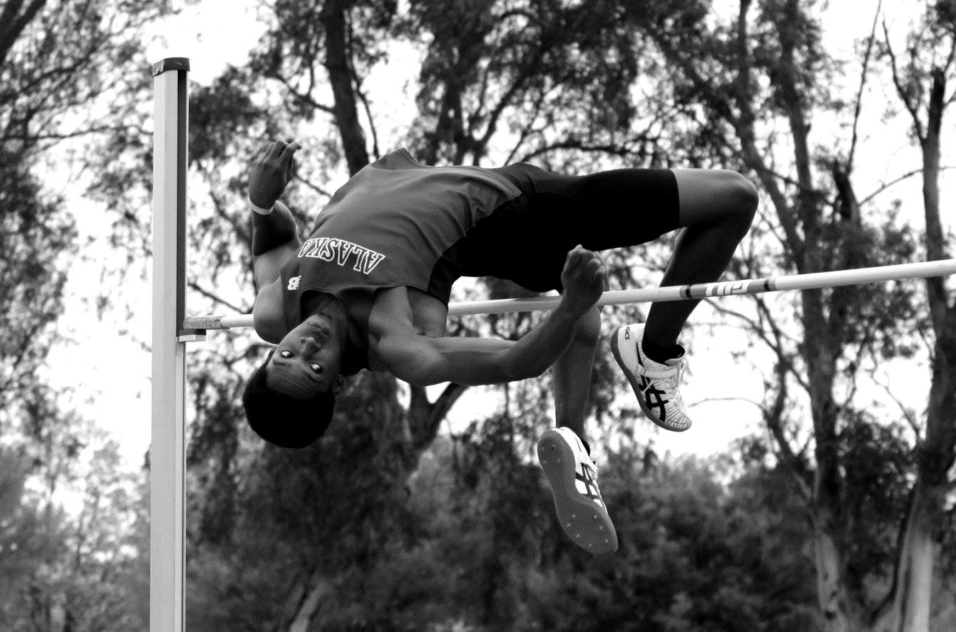 Outdoor high jump action at a Reno-Tahoe track meet