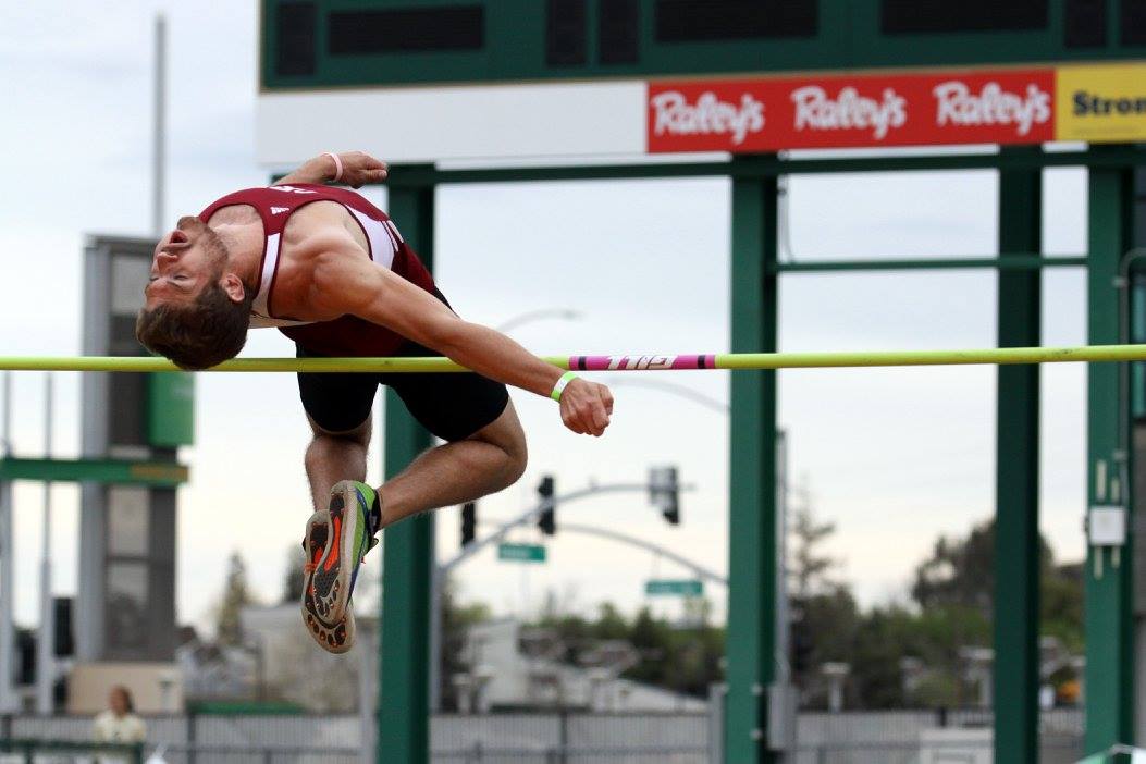 High jumper clearing the bar at a Reno track meet