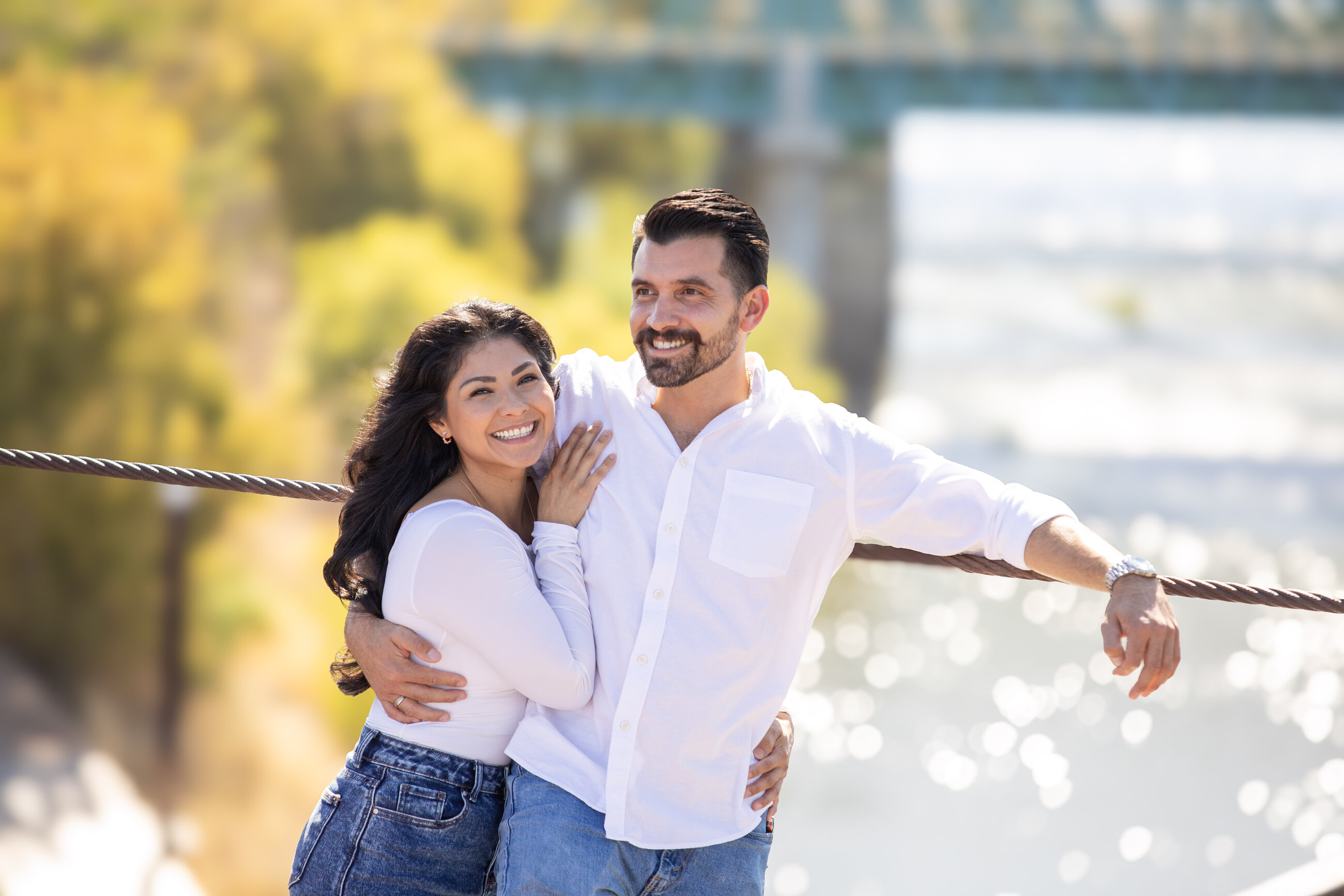 Engaged couple by the Truckee River in the Reno-Tahoe area