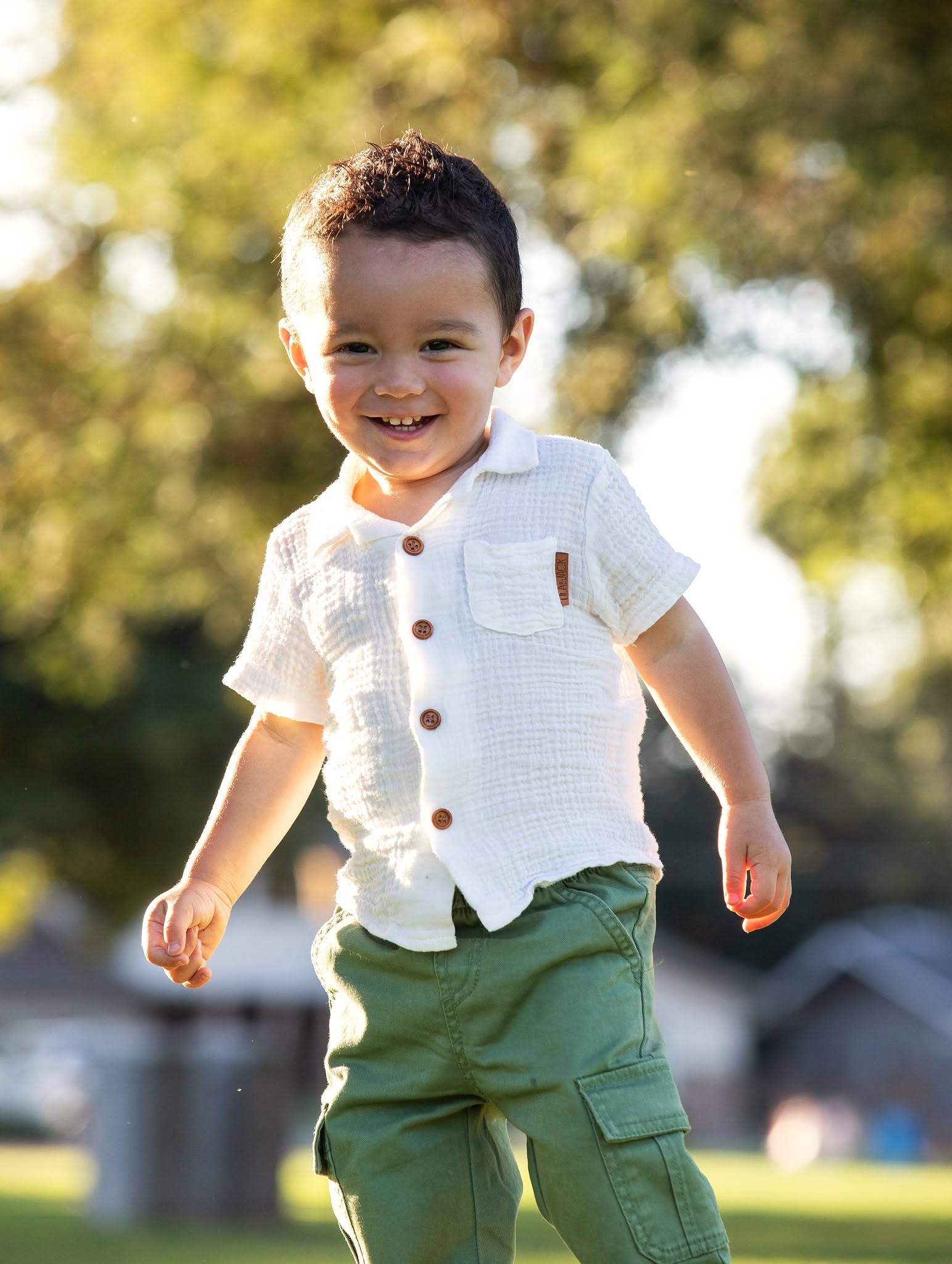 Joyful young child running in golden evening light at a Reno-Tahoe park